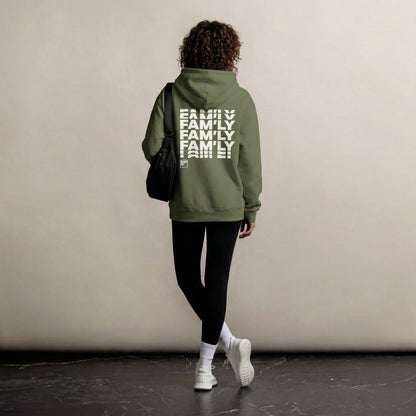 Person wearing a green hoodie with 'FAMILY' text on the back, walking against a plain wall.